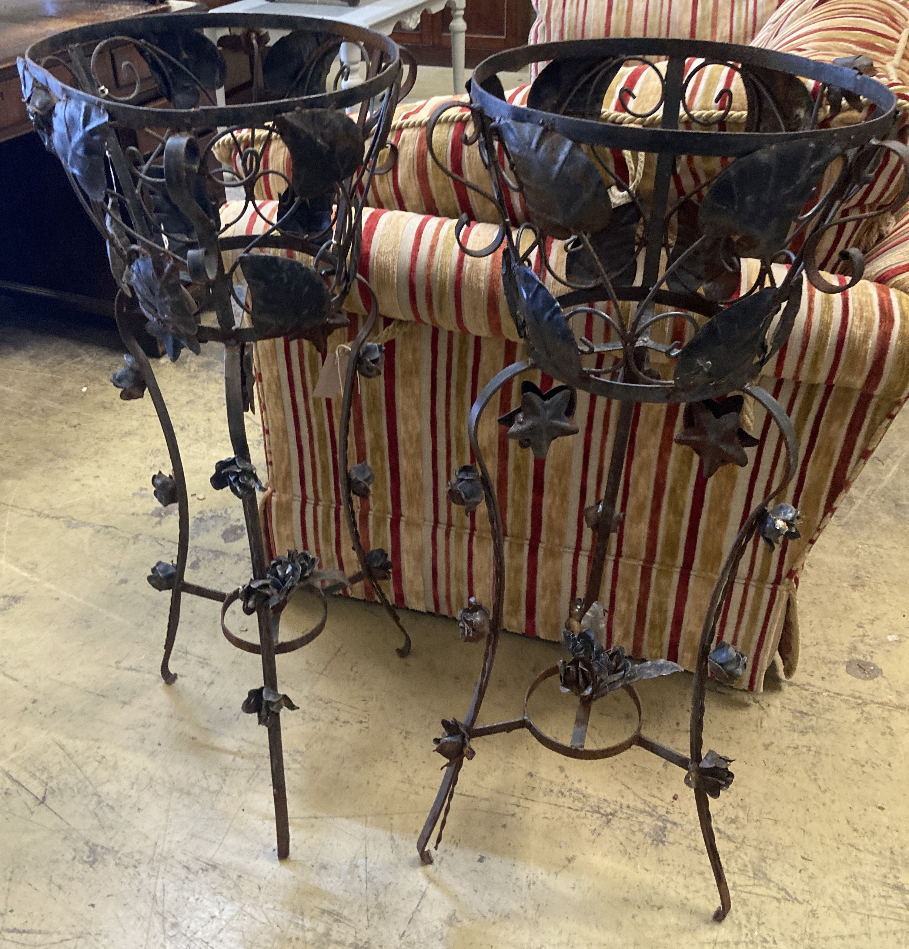 A pair of mid 20th century French wrought iron circular jardiniere stands, 42cm diameter, height 97cm